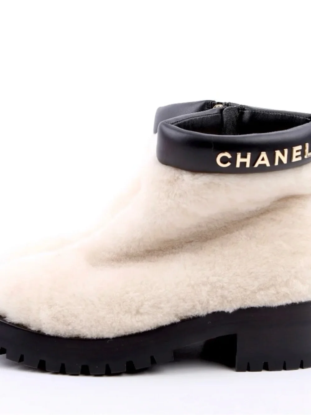 CHANEL Cream Shearling Ankle Boots with Black Leather Trim
